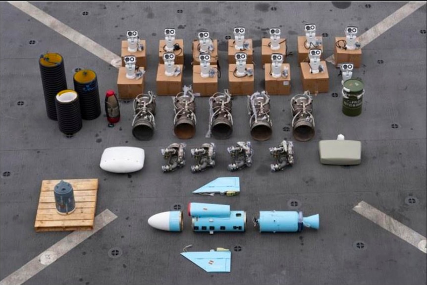Missile components laid out on the ground. 