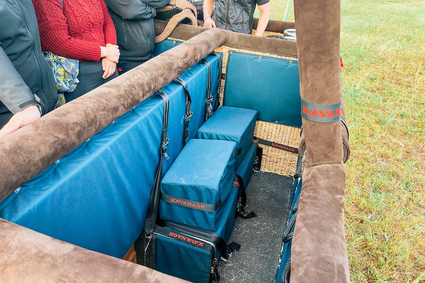 the inside of a hot air balloon featuring bench seating for those with a disability