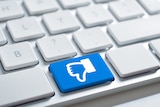 Facebook dislike icon on a white keyboard