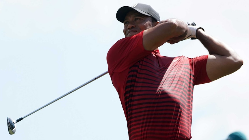 Tiger Woods watches his tee shot on the follow through during the final round of the US PGA Tour event in Florida.