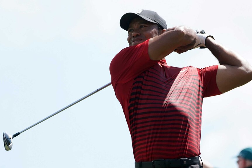 Tiger Woods watches his tee shot on the follow through during the final round of the US PGA Tour event in Florida.