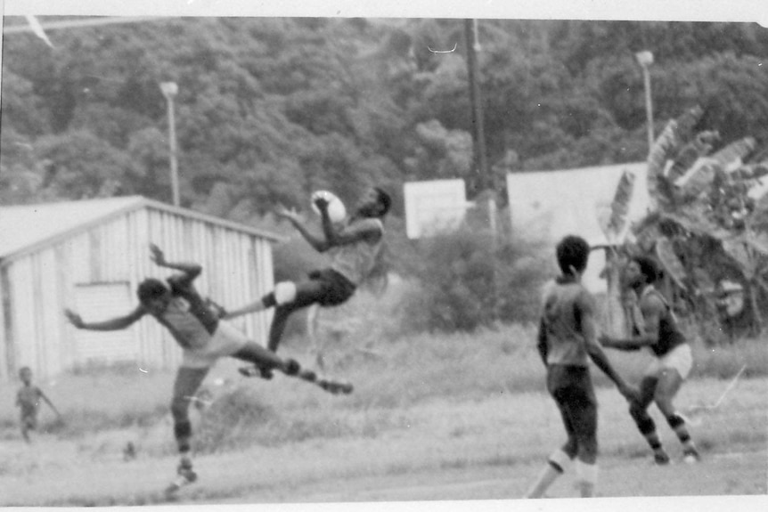 A high aerial mark is seen on an old photo during a match on the Tiwi Islands.