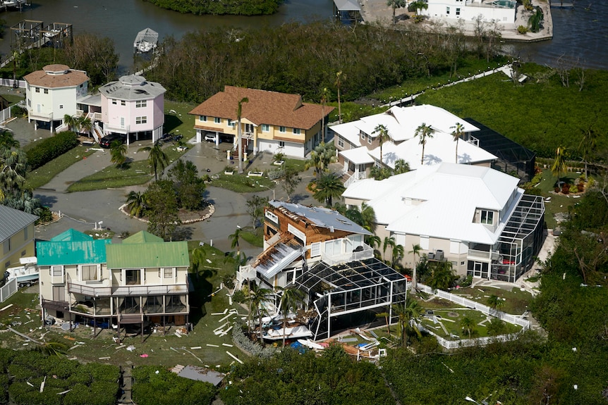An aerial photo of a number of large homes which were damaged by Hurricane Ian in Florida.