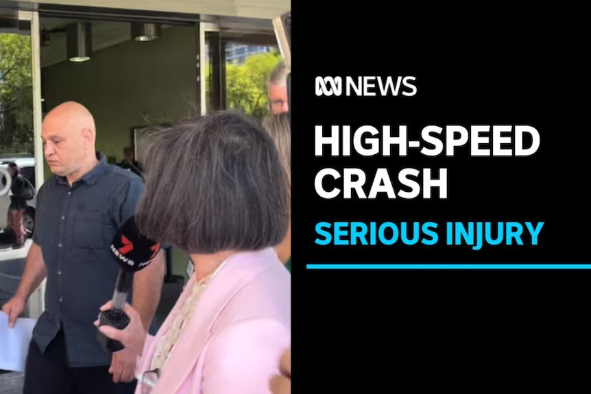 High-Speed Crash, Serious Injury: A reporter asks a man a question as he exits a building.
