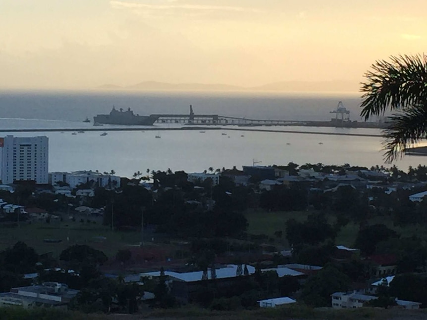 A long shot of HMAS Adelaide in dock in Townsville