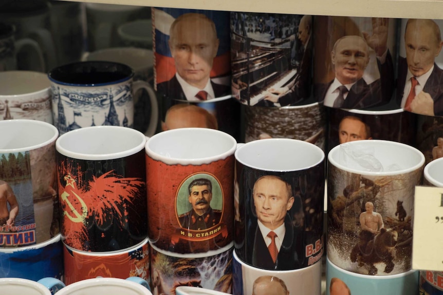 Souvenir mugs depict Russian President Vladimir Putin