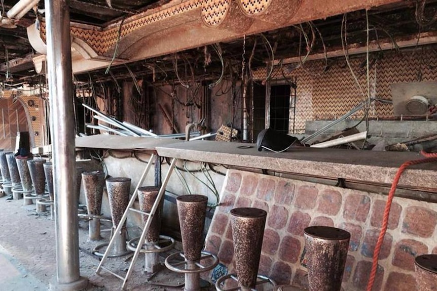 Damaged bar area, electrical chords and water damage can be seen onboard Costa Concordia ship