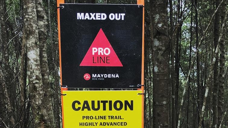 Warning sign at Maydena Bike Park, Tasmania.