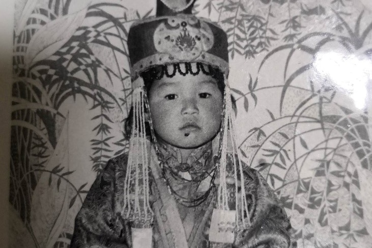 Mongolian child in traditional clothes and headwear