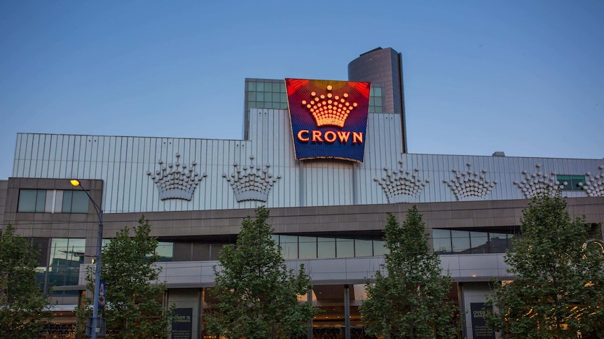 A neon sign glows on the Crown Casino building in Melbourne.