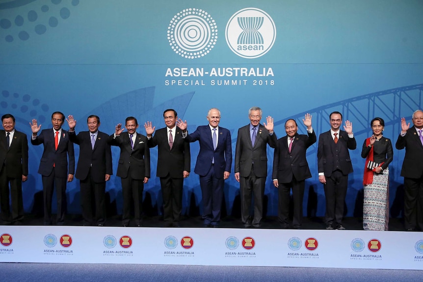 World leaders stand on stage at the ASEAN summit in Sydney.