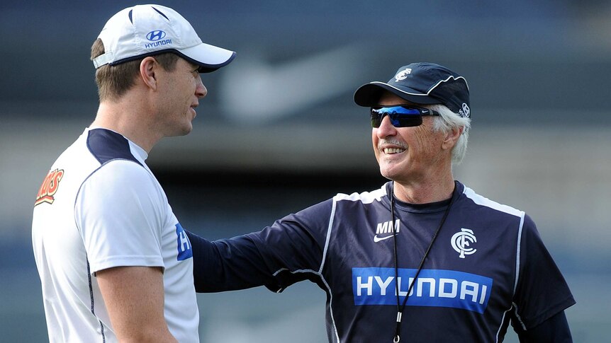 Carlton assistant coach John Barker (L) chats with coach Mick Malthouse at training in May 2013.
