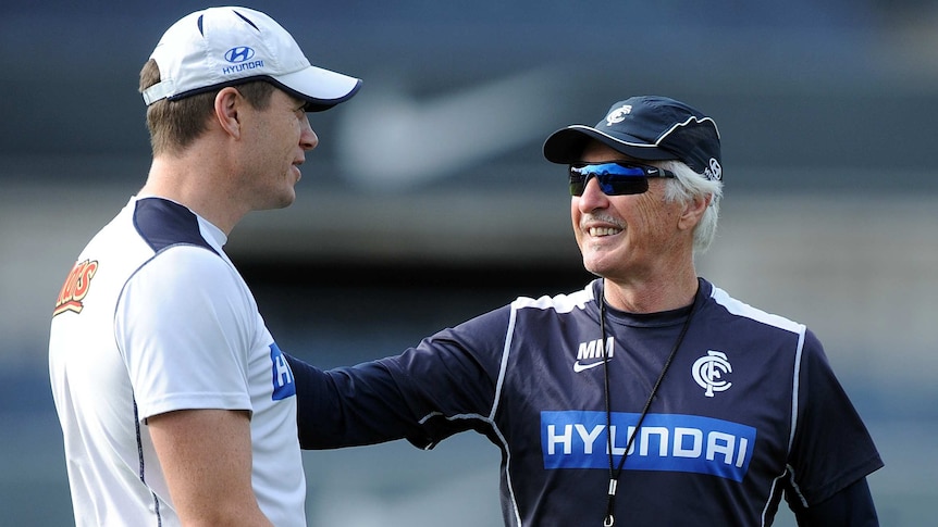 Carlton assistant coach John Barker (L) talks to coach Mick Malthouse at training