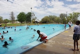 Picture of children playing in a pool on a summer's day