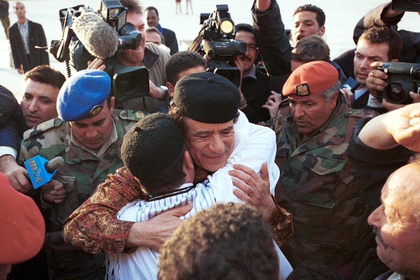 Gaddafi embraces Lockerbie bombing defendant Al-Amin Khalifa Fhimah