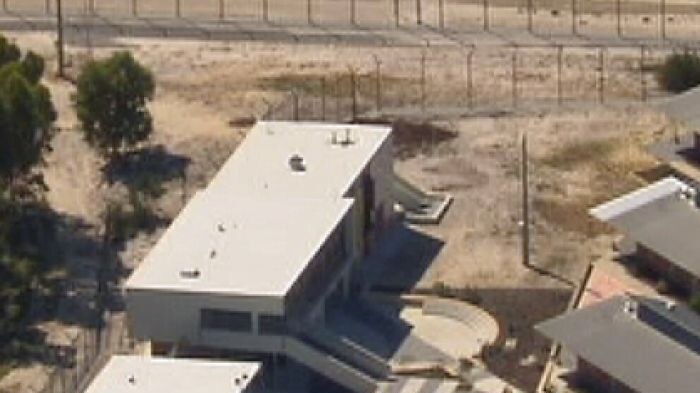 A prison guard at Banksia Hill (pictured) was escorting four juveniles when one of them allegedly attacked him.