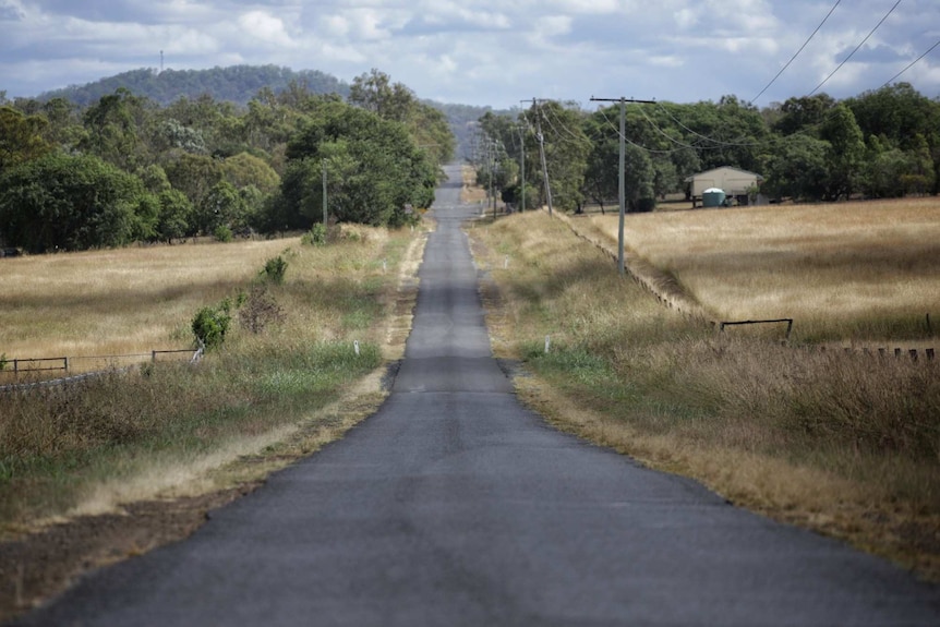 Sealed country road in Mutdapilly, south-west of Ipswich in south east Queensland.