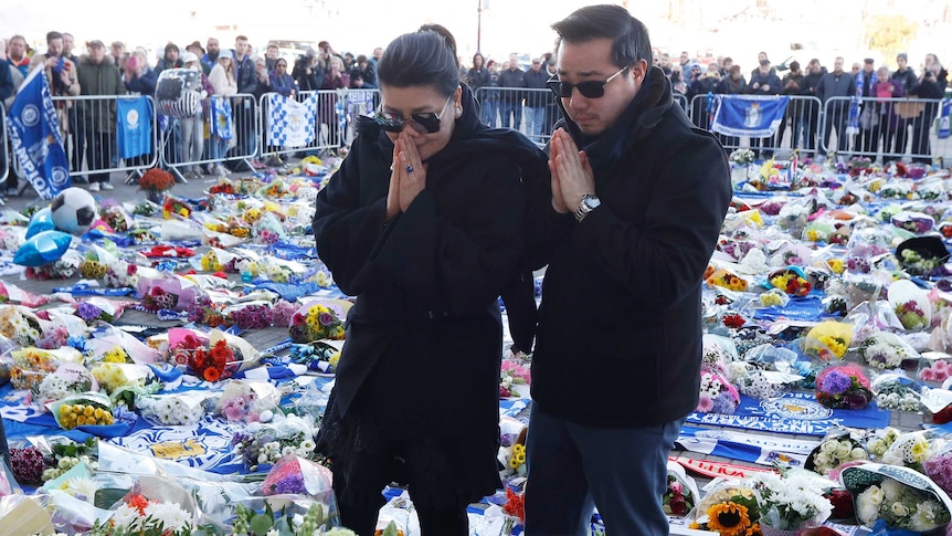 Leicester City's owner's wife and son lay wreath.