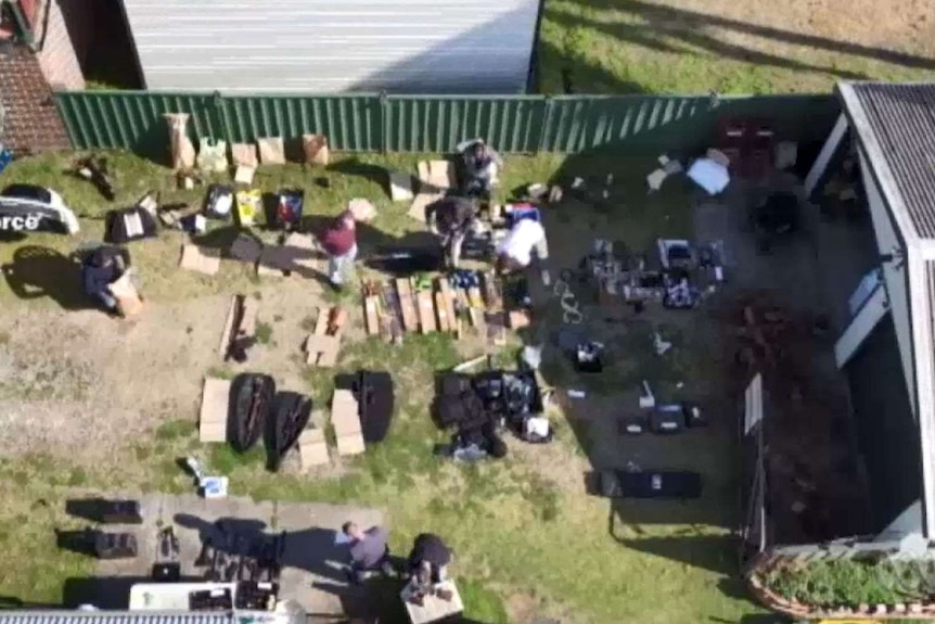 Weapons and armour laid out in a Sydney backyard