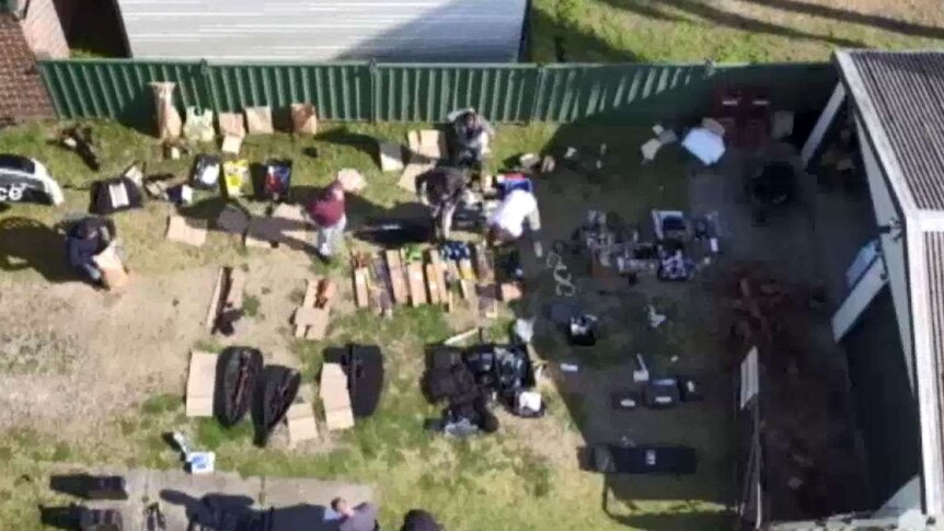Weapons and armour laid out in a Sydney backyard