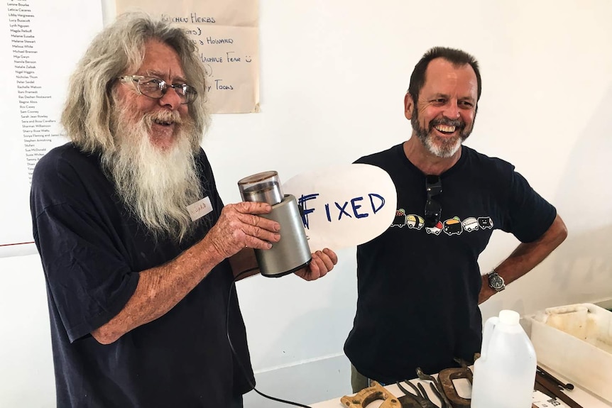Howard (left) fixed a broken coffee grinder at the Melbourne Repair Cafe.
