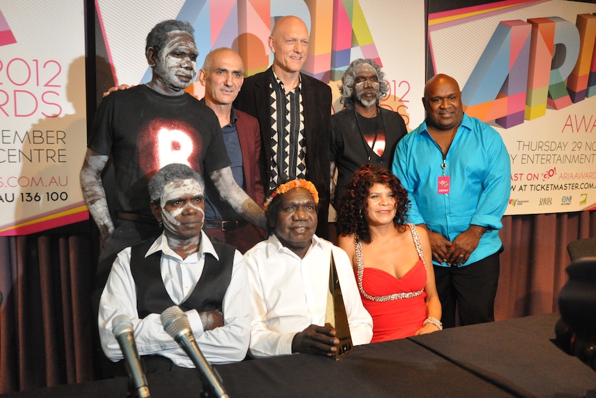a group of mostly aboriginal artists at a press conference