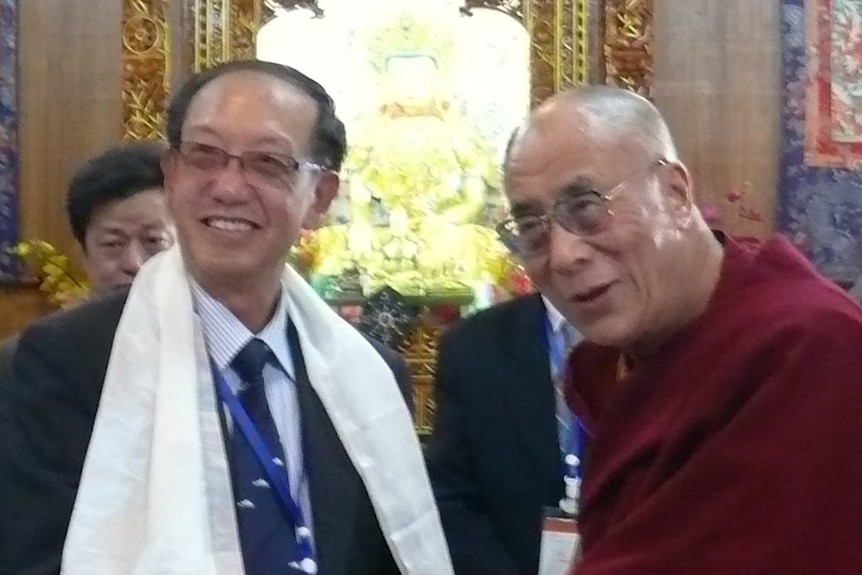 Two men having handshake in a temple.