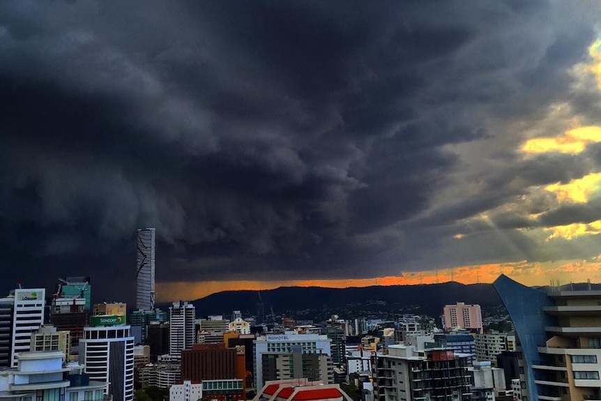 Dark storm clouds close in on Brisbane sky.
