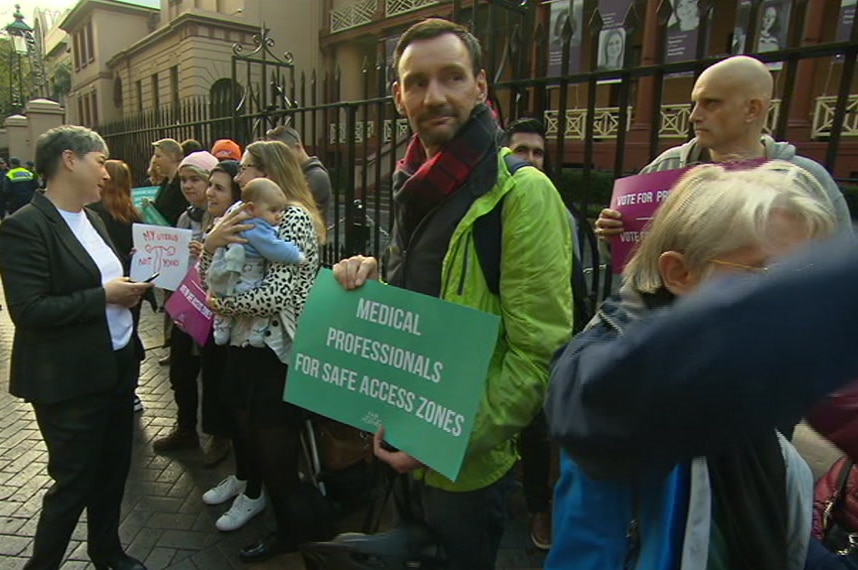 A man holding a sign