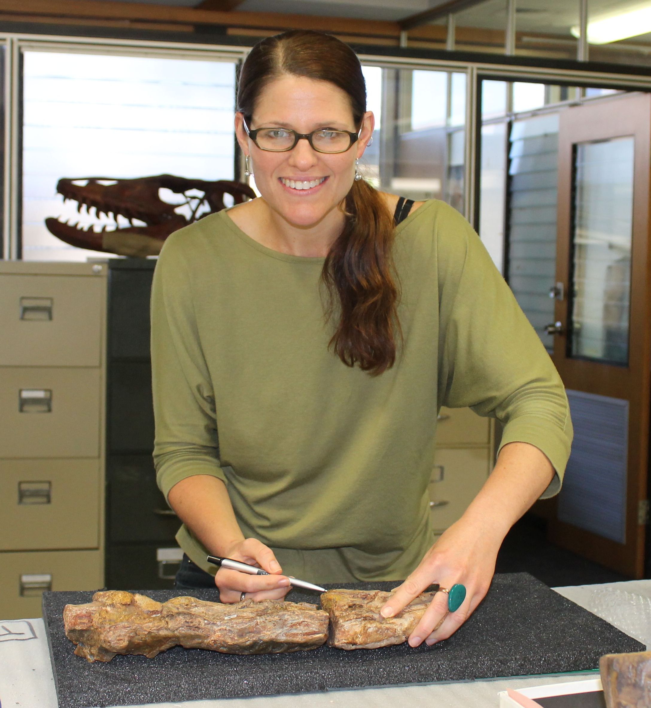  A female researcher holding geoscience tools 