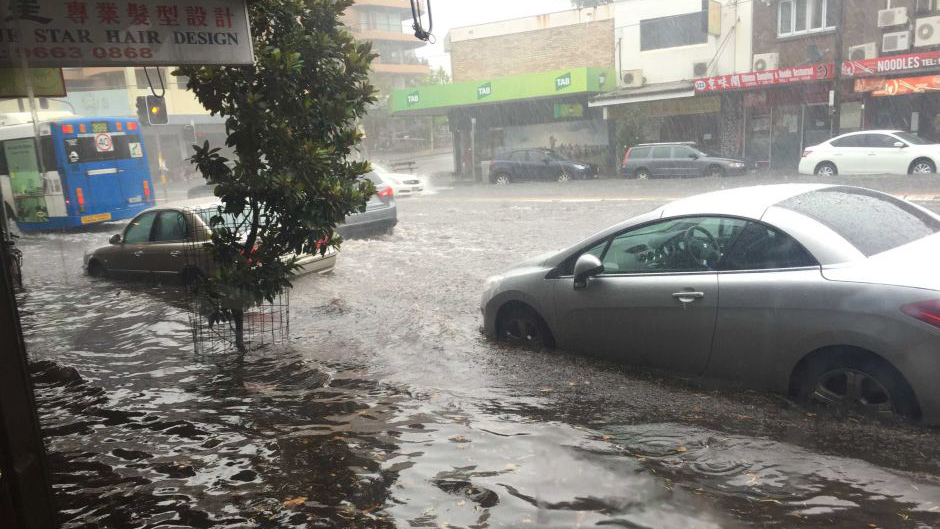 Cars under water on Anzac Parade at Kingsford in Sydney's east during storms
