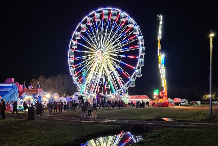 A ferris wheel lit up at night at the Orange showground.