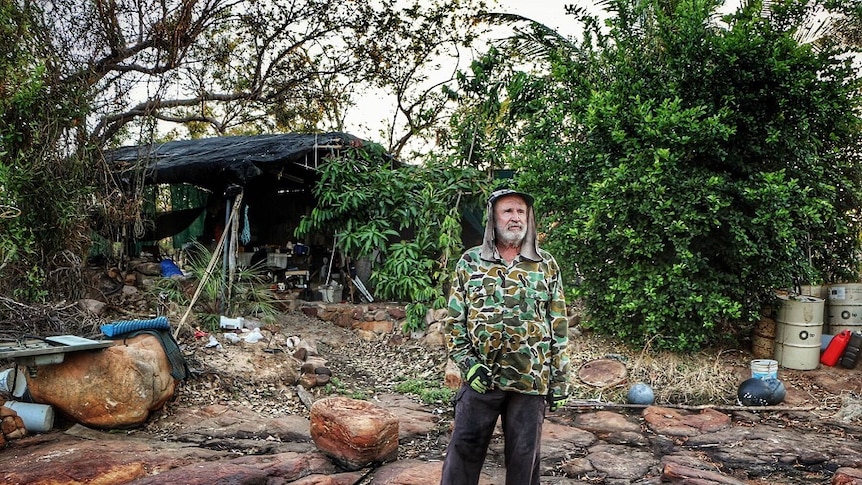 Don McLeod standing in front of the rustic camp where he has lived on the Drysdale River since 2003.