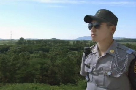 A soldier stands watch at the Korean de-militarised zone