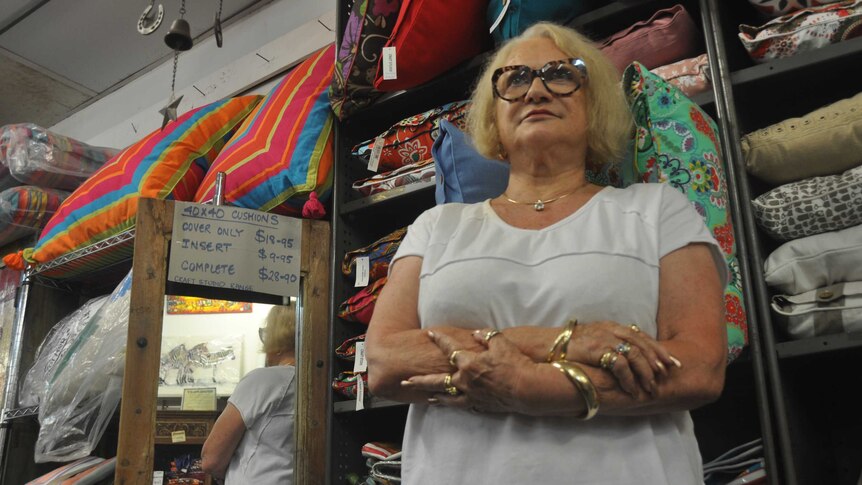 Angry business owner Dawn Sanders with her arms folded.