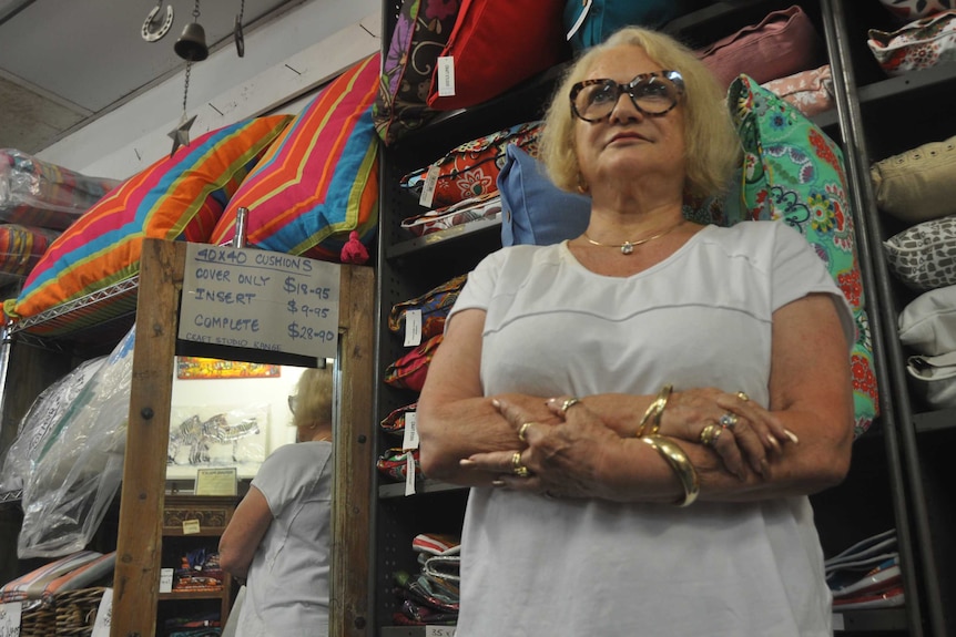 Angry business owner Dawn Sanders with her arms folded.