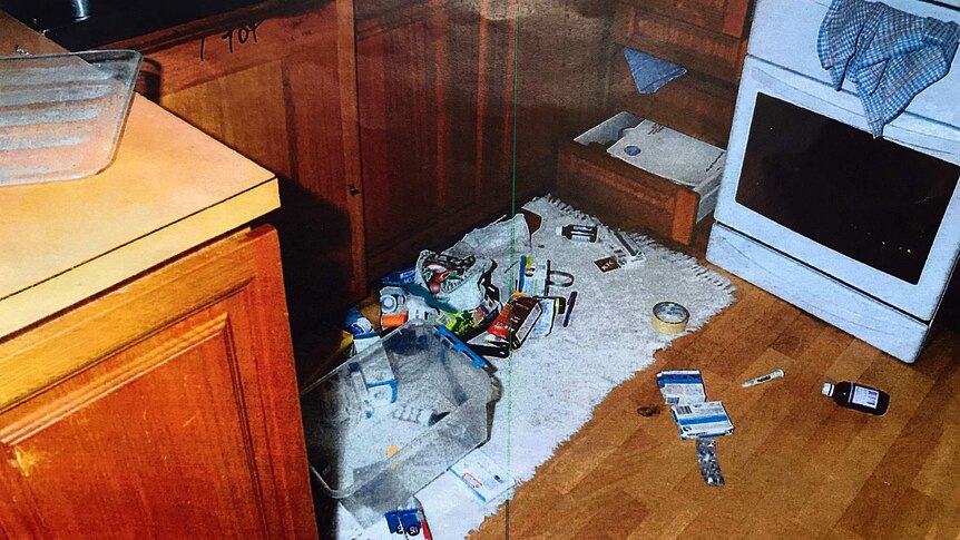 Alan Taylor's kitchen with items strewn across the floor in an attempt to make it look like a burglary.