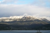 A layer of snow covers the peak of Mt Wellington