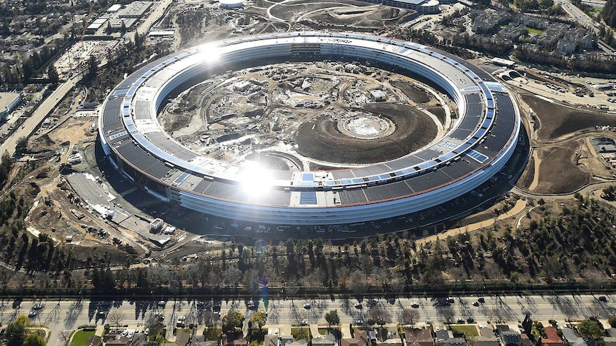The ring-like Apple Campus 2 is seen under construction from the air.