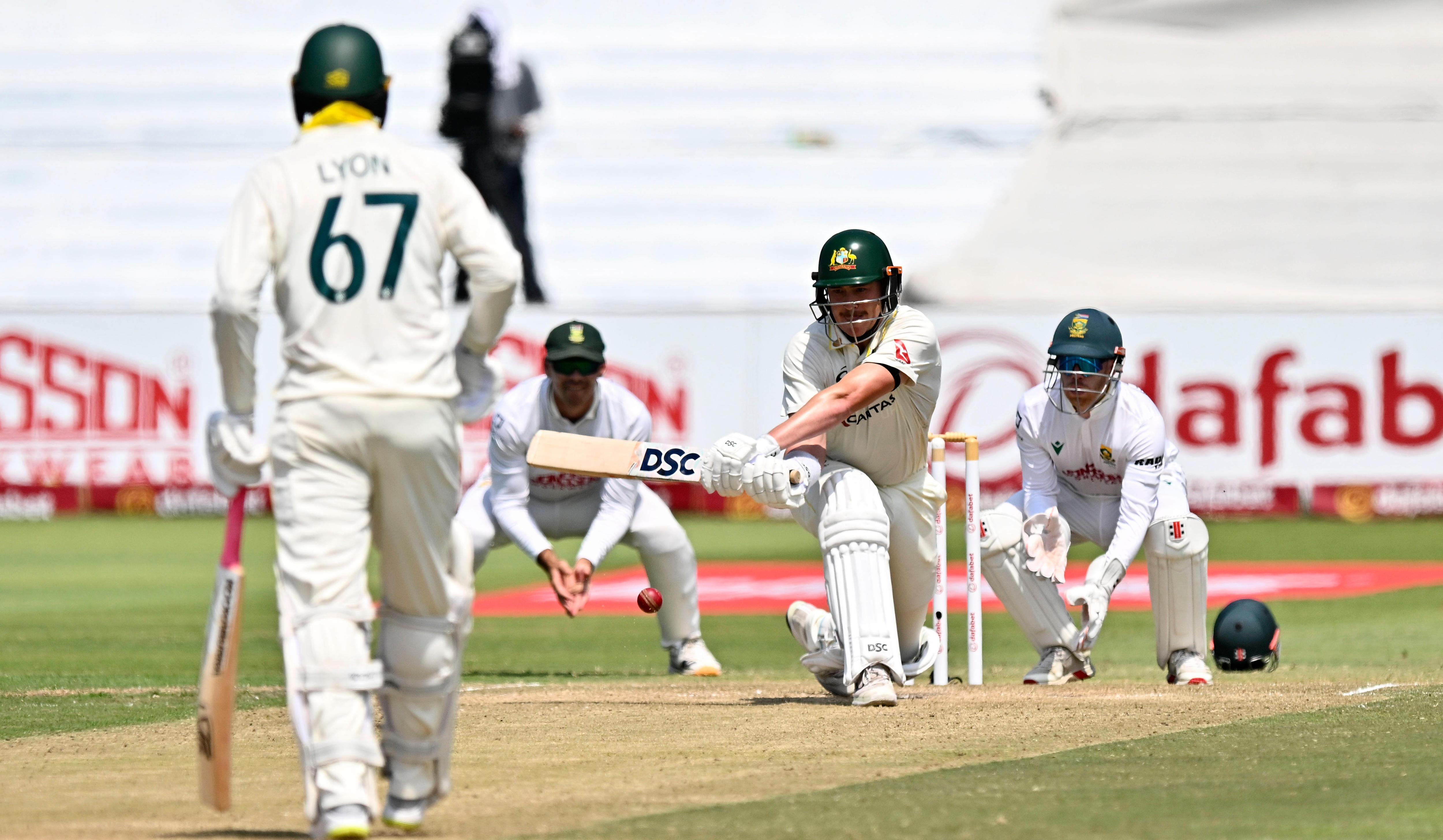 Australian batter Matt Renshaw gets on one knee to reverse sweep a spin delivery.