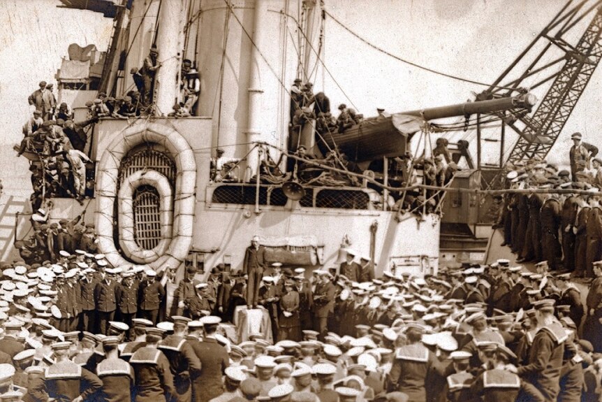 Large crowd on board warship