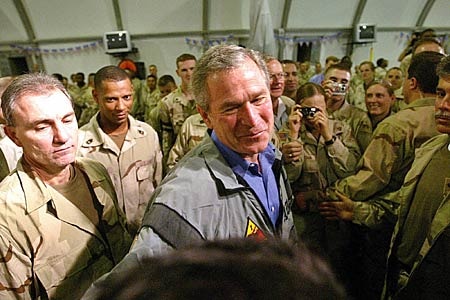 US President George W Bush greets troops in Baghdad.