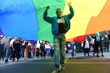 Demonstrators march through the streets of Sydney for marriage equality