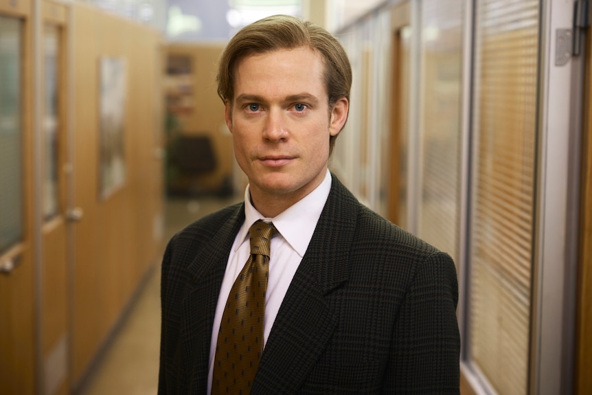 A man wearing a suit and tie.