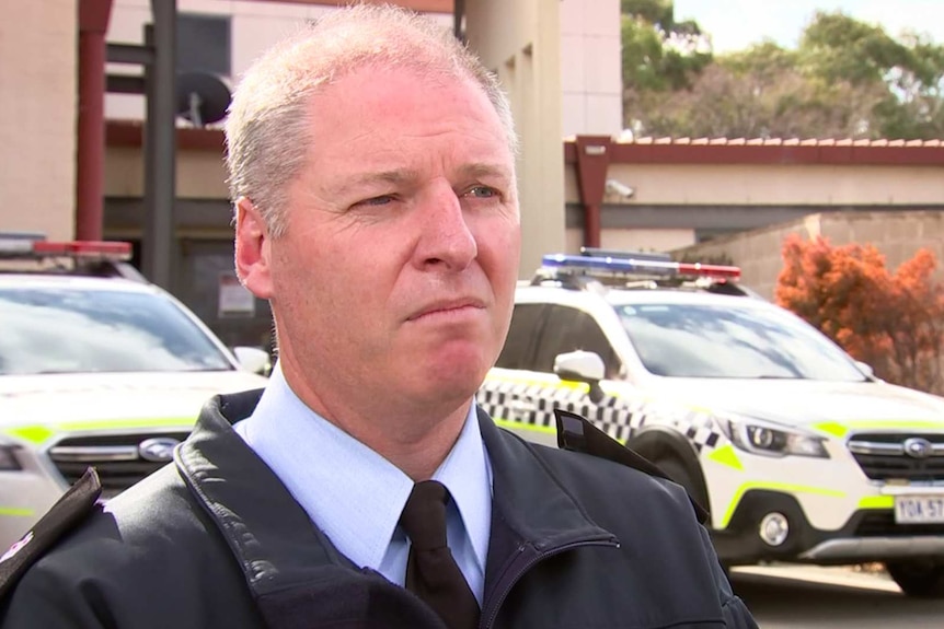 A policeman in uniform.