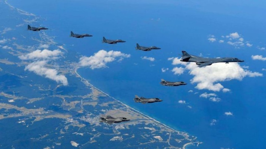 A US Air Force B-1B bomber, F-35B stealth fighter jets, and South Korean F-15K fighter jets fly over the peninsula.