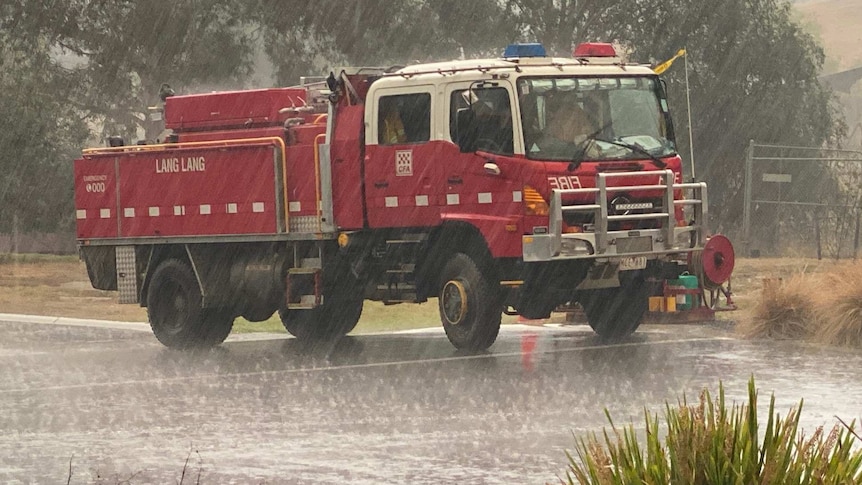 A red CFA truck in the rain.