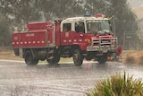 A red CFA truck in the rain.