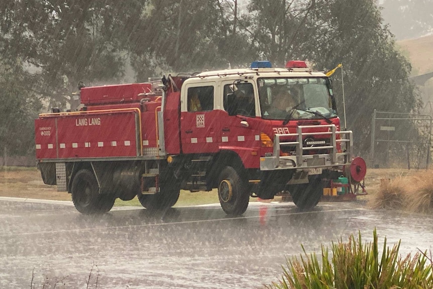 A red CFA truck in the rain.