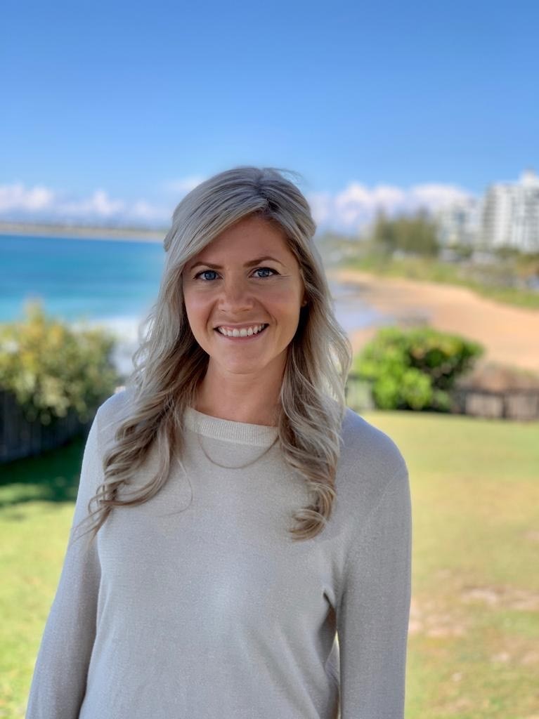 Woman standing on coastal lookout